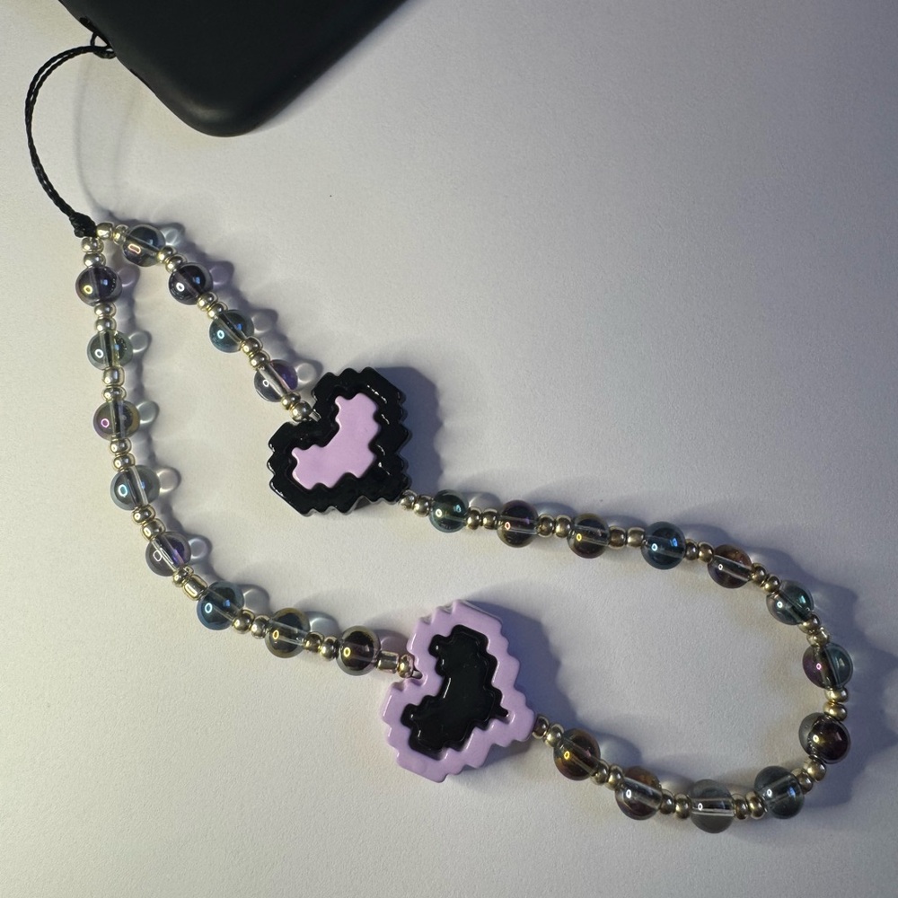 Cell phone wristlet from The Charm Hut works on any phone case